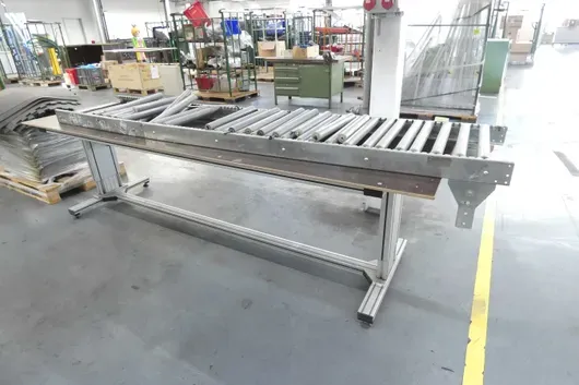 Work table with roller conveyor