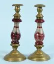 Candlestick – round base and socket brass, baluster shaft colourless glass, partly wine-red tinted, H= 25 cm, 19th c.