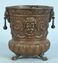 Planter – copper, on 3 claw feet, richly embossed decoration with plants and mascaroons in Renaissance style, baluster body with…