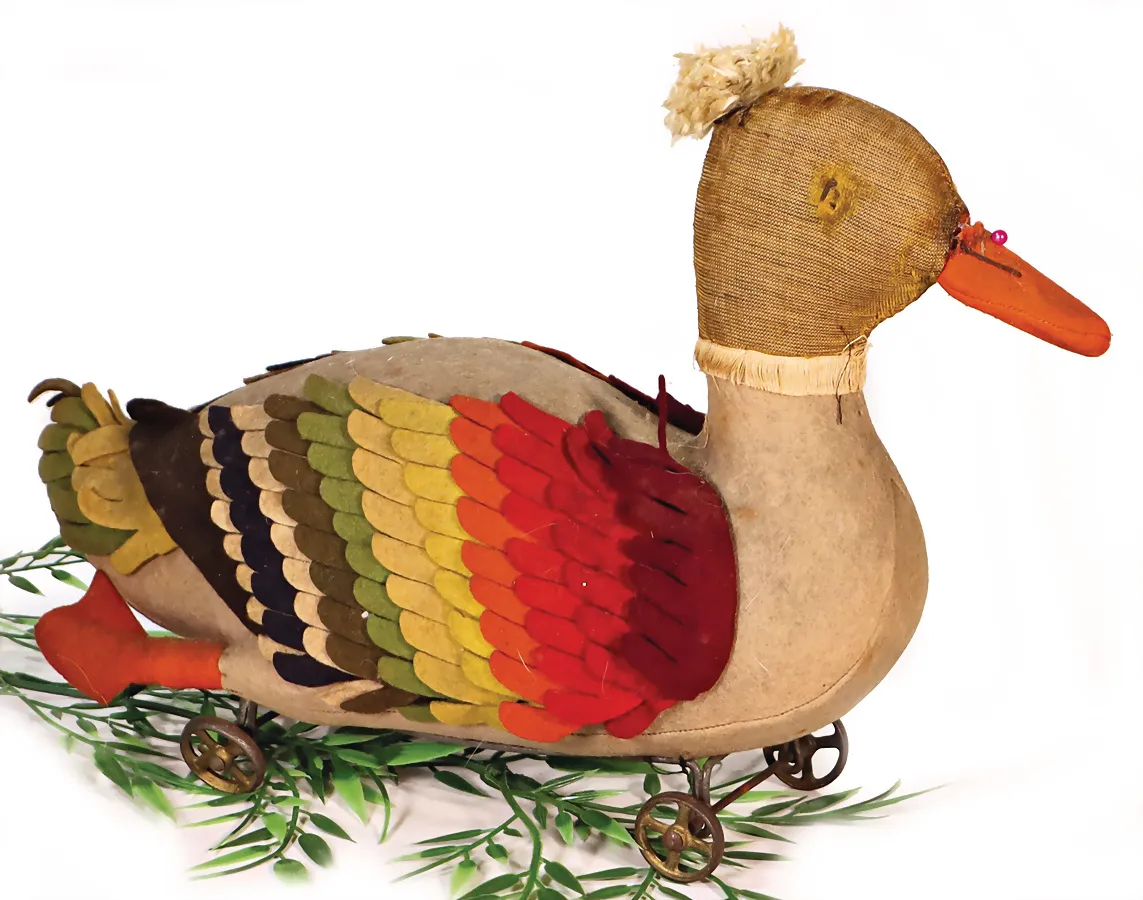 STEIFF – Canard sur petites roues en fonte à rayons