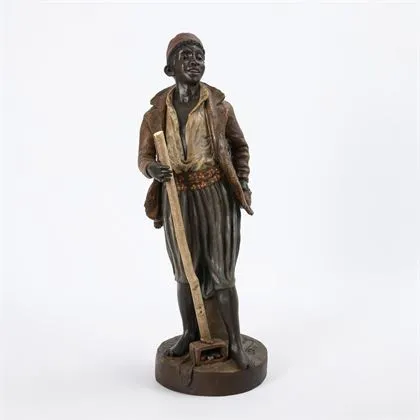 Afrikaanse jongen met schoenpoetsgerei
