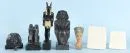Egyptian figures and reliefs, 7 pieces – various materials, H= 10-29 cm, replicas mostly by "Ars Mundi", including head of Nefertiti, statue of Anubis