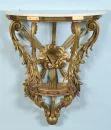 Figure base – wood, gilded and red, curved struts with carved acanthus leaf decoration, central carved cloud…