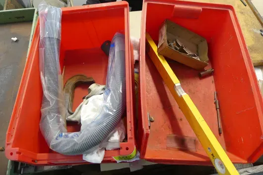 2x open-front storage bins, with contents