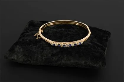 High-quality bangle with old-cut diamonds and blue stones, probably sapphires