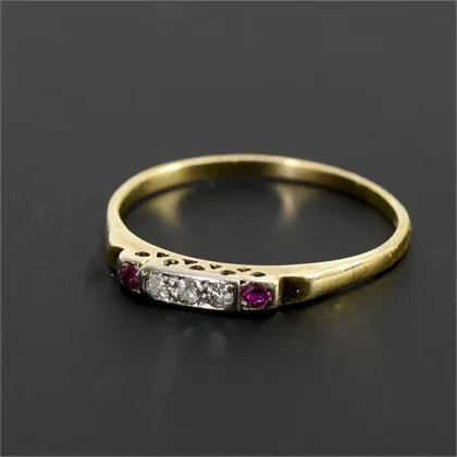 Delicate ring with diamonds and red stones