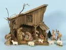 Weihnachtskrippe – Holz, 39 x 43 x 34 cm, mit 14 farbig gefassten Holzfiguren, H= 3-14 cm;