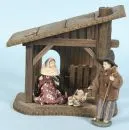 Weihnachtskrippe – Holz, braun gebeizt, 20 x 21 x 11 cm, mit Hl. Familie aus Kunstmasse mit Stoffbekleidung, H= 2,5-13 cm;