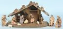 Weihnachtskrippe – Holz, braun gebeizt, 20 x 36 x 17 cm, mit 11 farbig gefassten Holzfiguren, H= 2-10 cm;