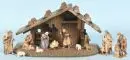 Crèche de Noël – bois teinté brun, 20 x 36 x 17 cm, avec 11 figurines en bois polychromées, H= 2-10 cm