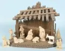 Weihnachtskrippe – Holz, braun gebeizt, 26 x 35 x 19 cm, mit 9 Holzfiguren, H= 3-10 cm;
