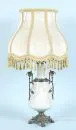 Table lamp – ceramic, light green glaze, white raised motif with nymph among reeds, baluster body, brass mounts
