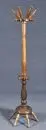 Porte-manteau – bois dur, teinté foncé, forme tournée avec porte-parapluies et crochets, H= 168 cm;