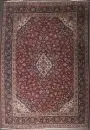Tapis Kork-Keschan, Perse, 320 x 425 cm – ancien, laine, tissage très fin, fond rouge, médaillon multicolore, entouré de motifs floraux, bordure principale à fond bleu foncé