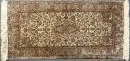 Silk Kashmir, India, 47 x 94 cm – light ground, multicoloured central piece, surrounded by floral vine motifs, pronounced main border