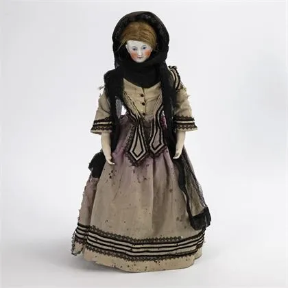 Borstkopfpop in originele kleding
