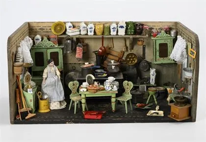 Poppenkeuken met groene blikken meubels