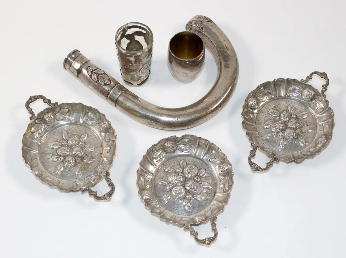 Hanau probably – Three ear bowls with hammered fruit decor