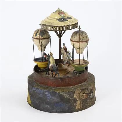 Rare et ancien carrousel en tôle avec musique
