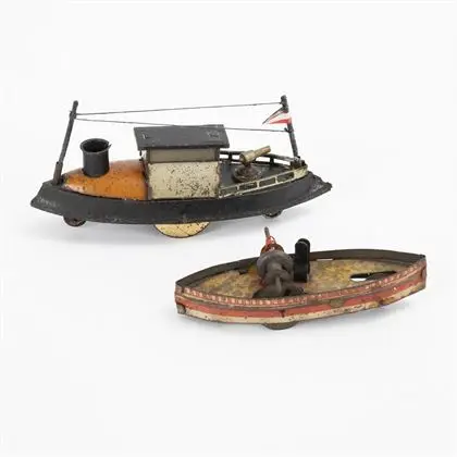 2 petits bateaux en tôle sur roues