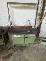 2 workbenches, one with vice