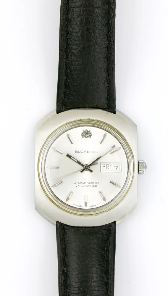 Watch, wristwatch, Bucherer, steel, rounded case, diameter approx. 35 mm, silver dial with baton numerals, day and date display, "Officially Certified Chronometer". Leather strap. Runs, long-term function not tested. Bucherer sold to Rolex in 2023. Partnership since 1924.