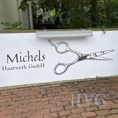 beleuchtetes Werbeschild "Michels Haarwerk GmbH"