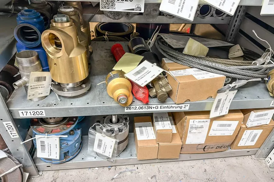 Contents of 2 shelf levels: machine components